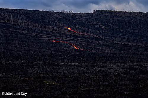 Lava glowing at night in Hawai'i Volcanoes National Park, Island of Hawai'i, Hawai'i