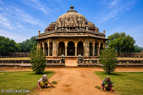 Labourers working to maintain paths around The Tomb of the Mughal Emperor Humayun (commissioned in 1558), Delhi, India