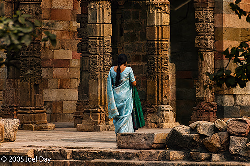 Visitors to the Monuments and Buildings of the Qutb Minar complex (finished in 1368), Delhi, India