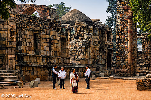 Visitors to the Monuments and Buildings of the Qutb Minar complex (finished in 1368), Delhi, India