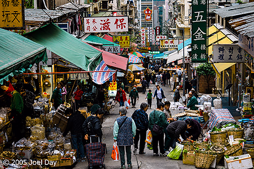Busy street market in hilly Hong Kong, China
