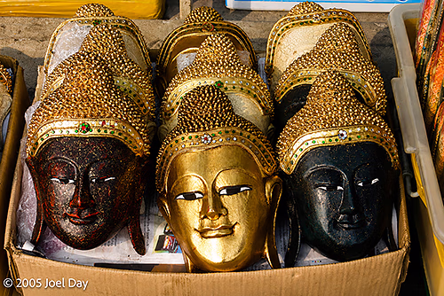 Ornate Buddha Heads in a Market Box, Bangkok, Thailand