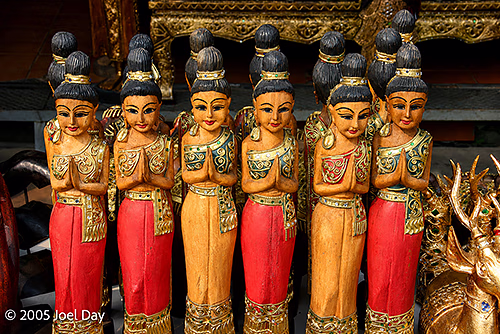 Golden Thai Wai Statues in a market stall, Bangkok, Thailand