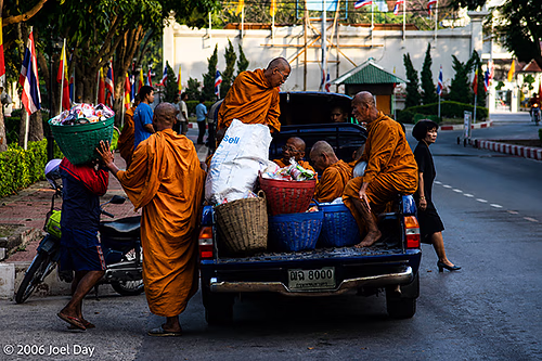 Buddhist Monks picking up supplies in Ayutthaya, Thailand