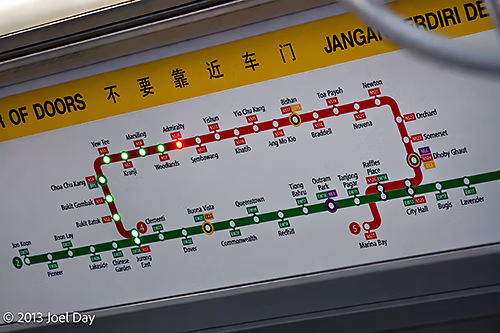 Mass Rapid Transit (MRT) map illuminating location in subway car in Singapore