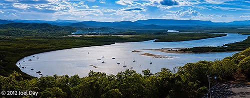 Boats moored on the Endeavour River flowing past Cooktown, Queensland