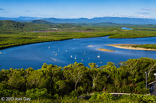 Boats moored on Endeavour River flowing past Cooktown, Queensland
